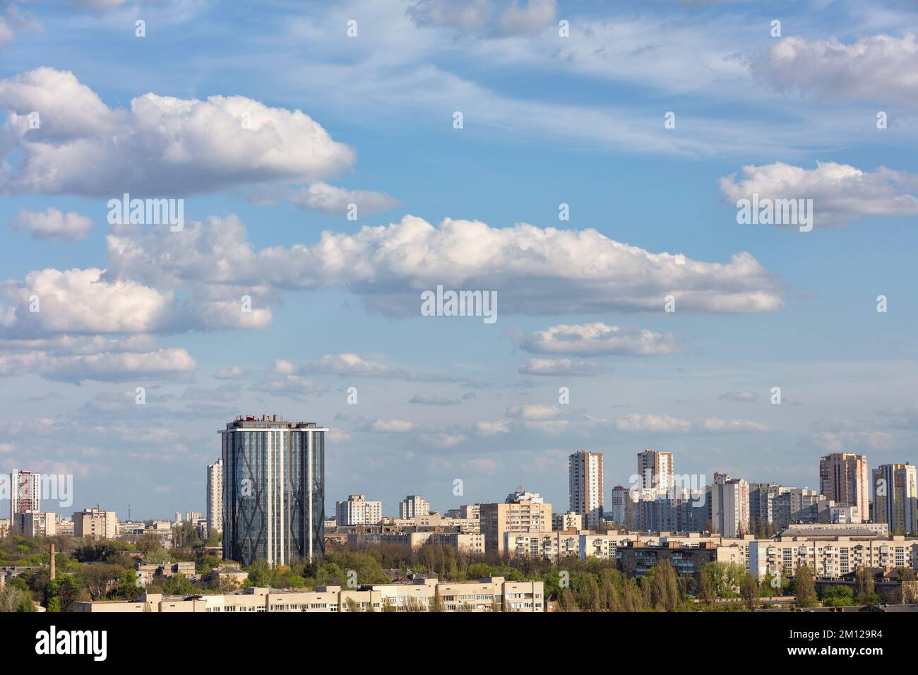 Blue sky with white clouds floating over city buildings under ...