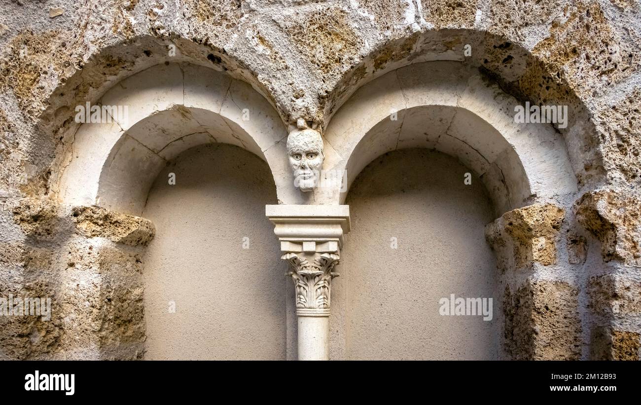 Detail of the monastery of Gellone in Saint Guilhem le Désert. The monastery site was built in the IX century and is designated as part of the UNESCO World Heritage 'Way of Saint James in France'. The village belongs to the Plus Beaux Villages de France. Stock Photo