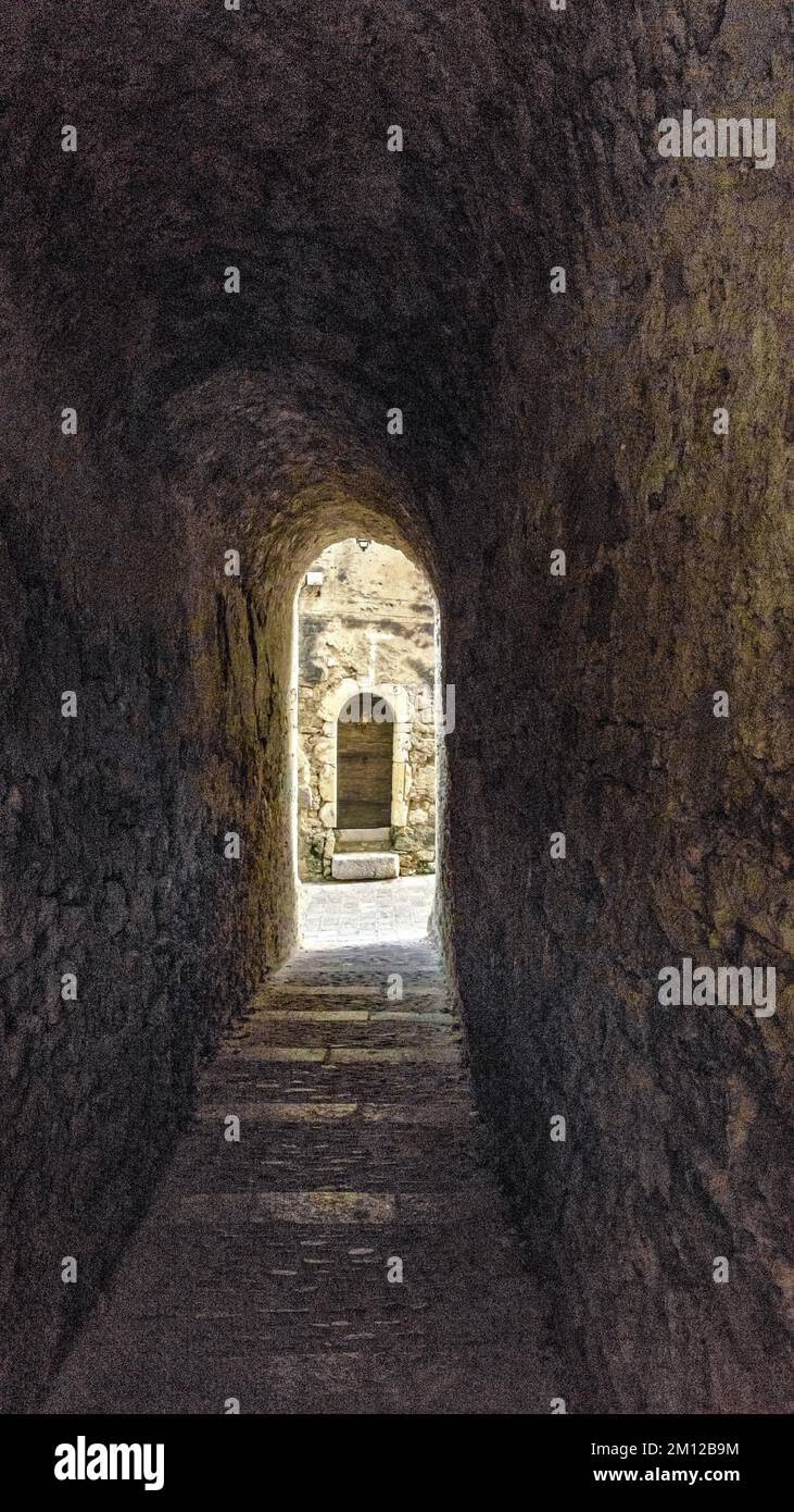 Stone passage in Saint Guilhem le Désert. Part of the World Heritage Site of UNESCO 'Way of Saint James in France' awarded. The village is one of the Plus Beaux Villages de France. Stock Photo