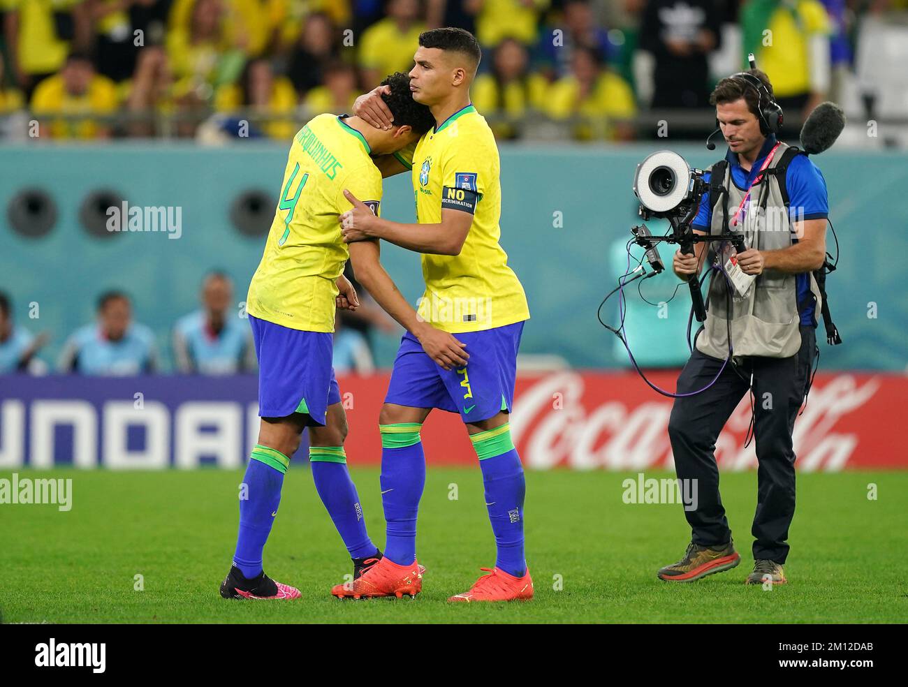 Brazil's Marquinhos (left) is consoled by team-mate Thiago Silva after defeat in the penalty shootout following extra time during the FIFA World Cup Quarter-Final match at the Education City Stadium in Al Rayyan, Qatar. Picture date: Friday December 9, 2022. Stock Photo