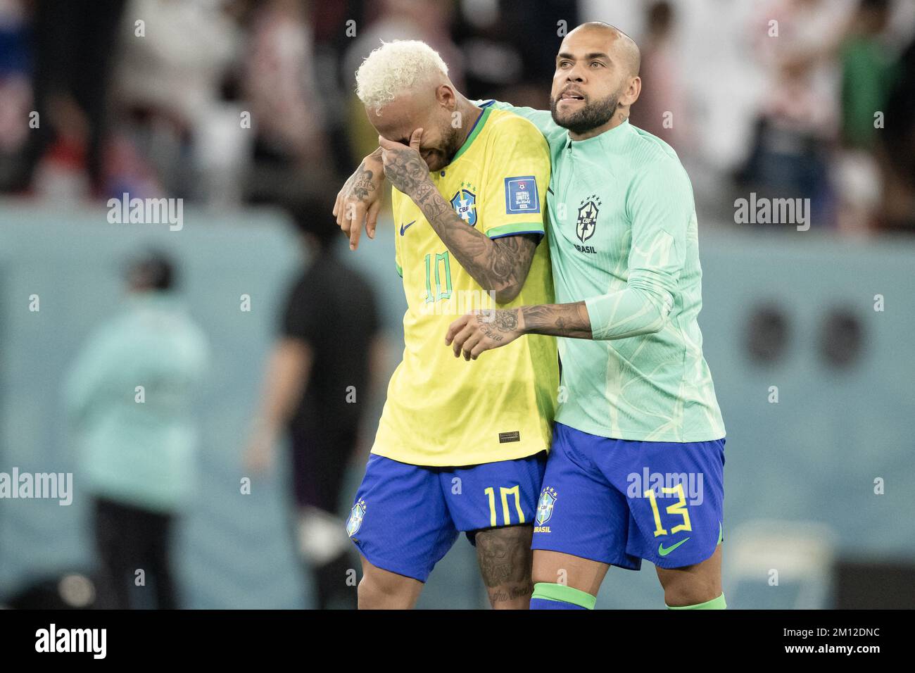 Doha, Qatar. 09th Dec, 2022. Doha, Qatar. 09th Dec, 2022. Neymar Jr and Dani Alves of Brazil look dejected after their sides' elimination from the tournament after a penalty shoot out loss during the FIFA World Cup Qatar 2022 quarter final match between Croatia and Brazil at Education City Stadium on December 09, 2022 in Doha, Qatar. Photo by David Niviere/ABACAPRESS.COM Credit: Abaca Press/Alamy Live News Credit: Abaca Press/Alamy Live News Credit: Abaca Press/Alamy Live News Stock Photo