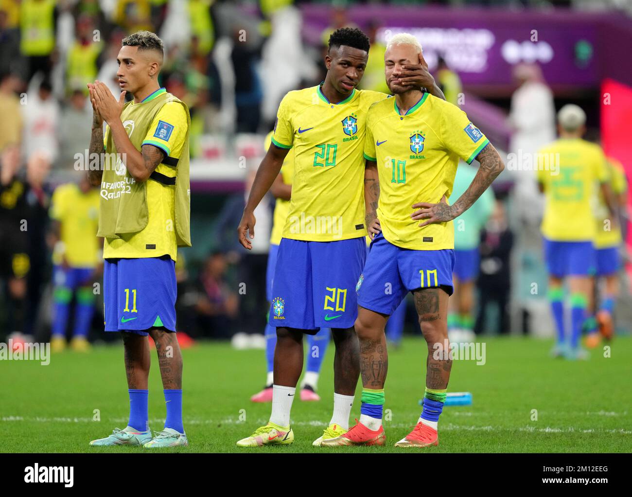 Brazil's Raphinha, Vinicius Junior and Neymar react to defeat in a penalty shoot-out following the FIFA World Cup Quarter-Final match at the Education City Stadium in Al Rayyan, Qatar. Picture date: Friday December 9, 2022. Stock Photo