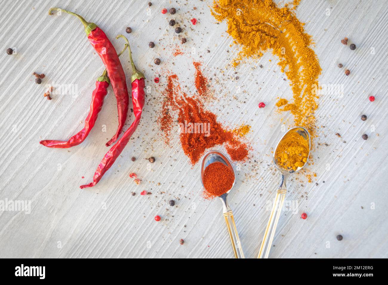 colored powders of spices, turmeric and paprika, hot pepper Stock Photo