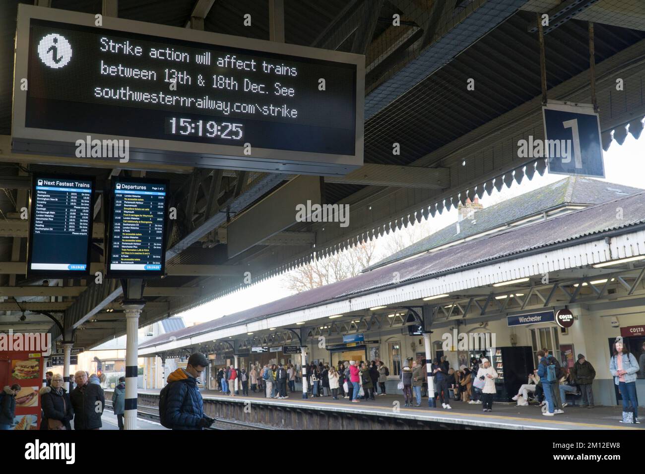 Winchester, UK, 9 December 2022: South Western Railway trains at Winchester station, where notice boards warn of upcoming strikes by the RMT union, which represents drivers and maintenance staff. The strikes from mid-December and over the Christmas period relate to a dispute over pay, pensions and working conditions. Anna Watson/Alamy Live News Stock Photo