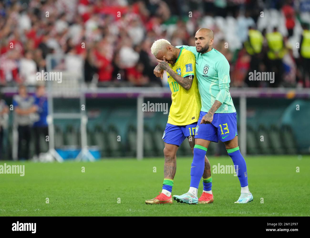 Brazil's Neymar and Dani Alves react to defeat in a penalty shoot-out following the FIFA World Cup Quarter-Final match at the Education City Stadium in Al Rayyan, Qatar. Picture date: Friday December 9, 2022. Stock Photo