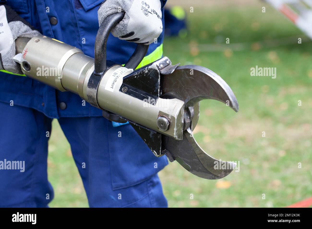 hydraulic rescue pliers in the hands of the worker Stock Photo Alamy