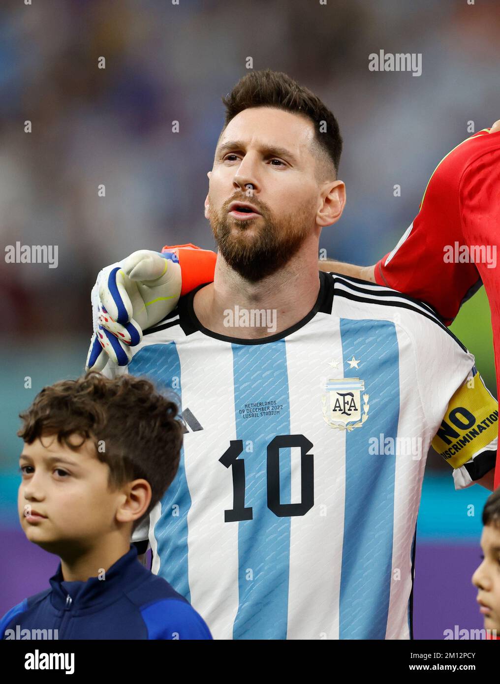 Lusail, Qatar. 9th Dec, 2022. Lionel Messi of Argentina reacts during the national anthem prior to the Quarterfinal between the Netherlands and Argentina of the 2022 FIFA World Cup at Lusail Stadium in Lusail, Qatar, Dec. 9, 2022. Credit: Wang Lili/Xinhua/Alamy Live News Stock Photo