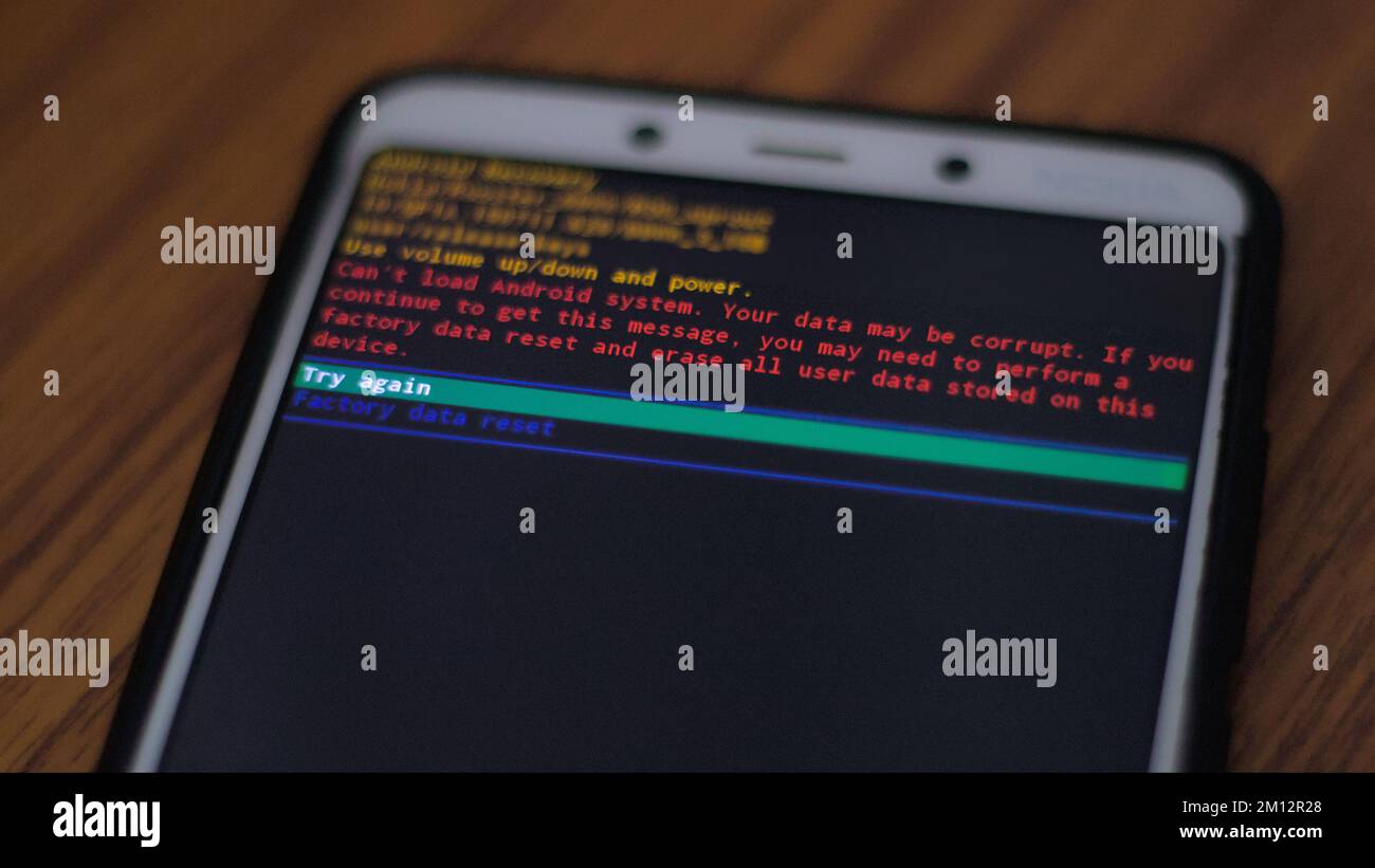 An android phone screen showing system breakdown or factory data reset message. Stock Photo