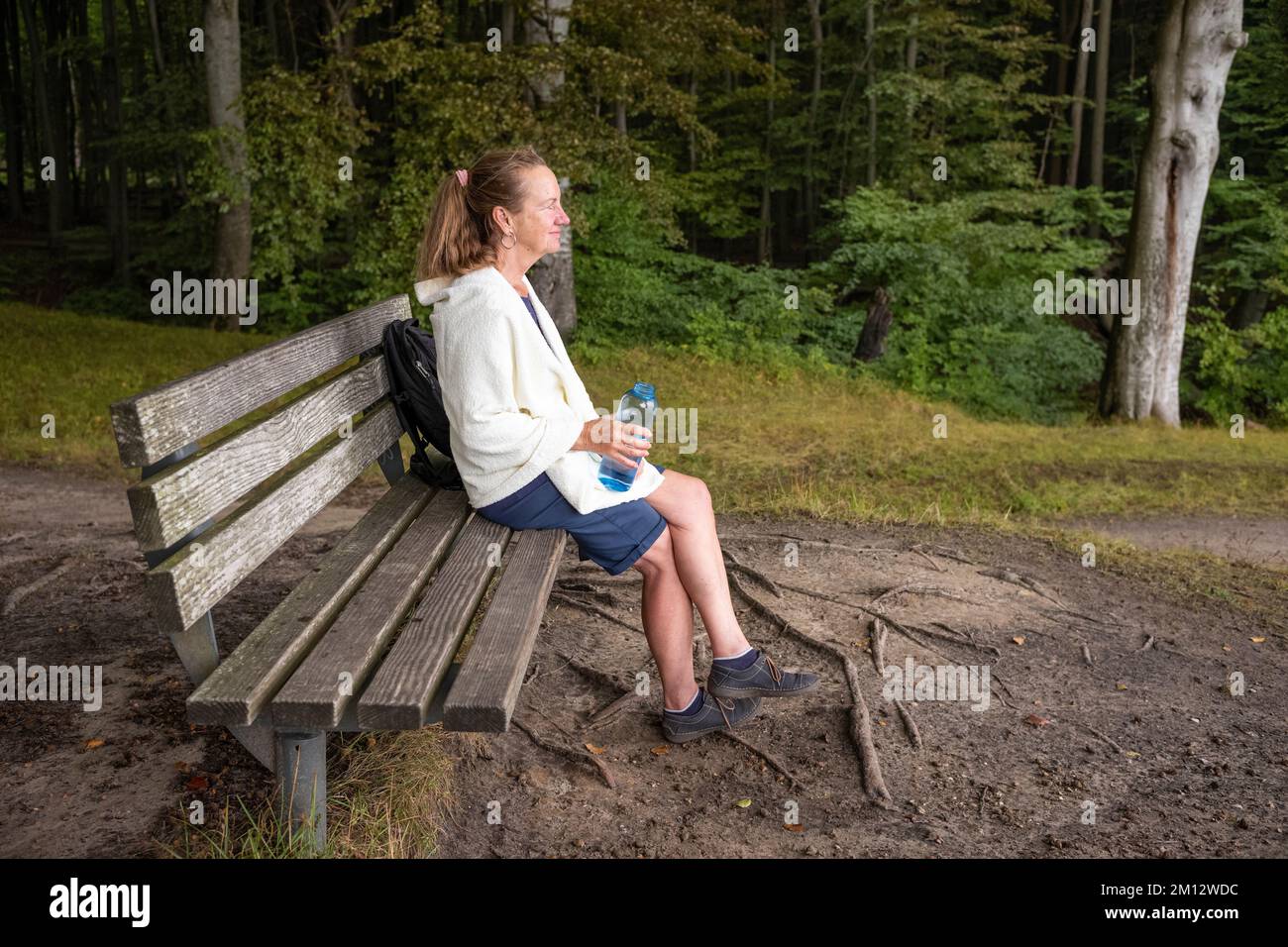 Senior woman walking in Jasmund National Park in autumn, Mecklenburg-Western Pomerania Stock Photo