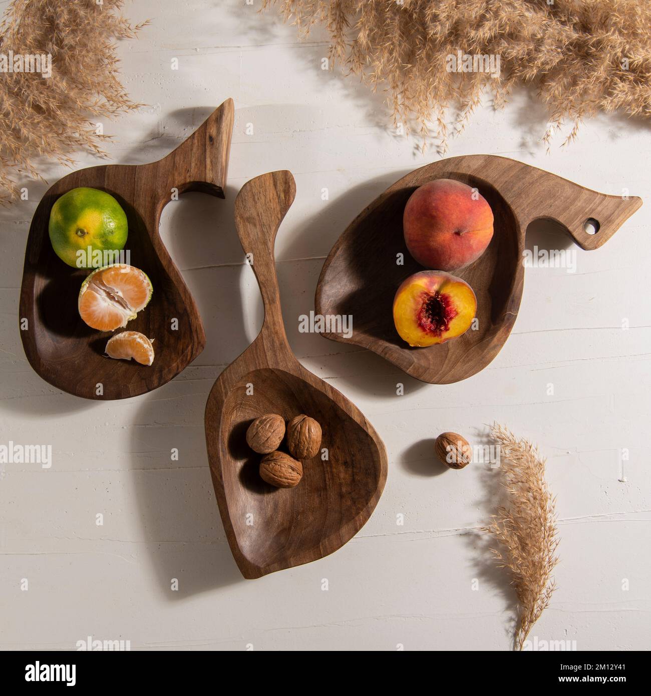 handmade wooden boards with fruits on table Stock Photo - Alamy