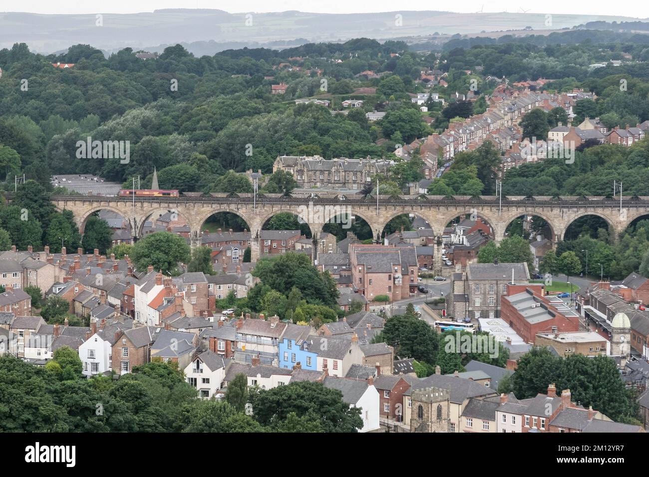 Class 66 diesel locomotive 66088 hauls an EWS coal train south over Durham railway viaduct, England, UK Stock Photo