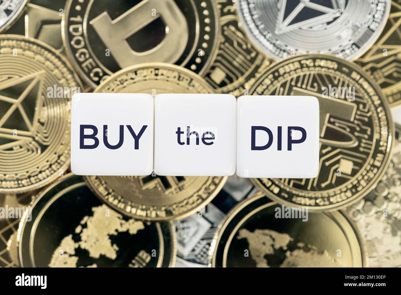Buy the Dip concept. Text on cube blocks on crypto coins background. Top  view Stock Photo - Alamy