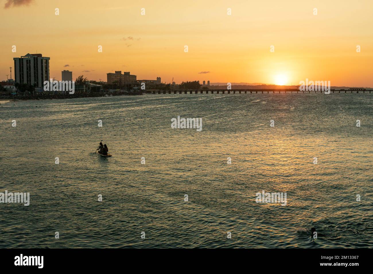 two people canoeing in the sunset of Fortaleza Ceara north of Brazil Stock Photo