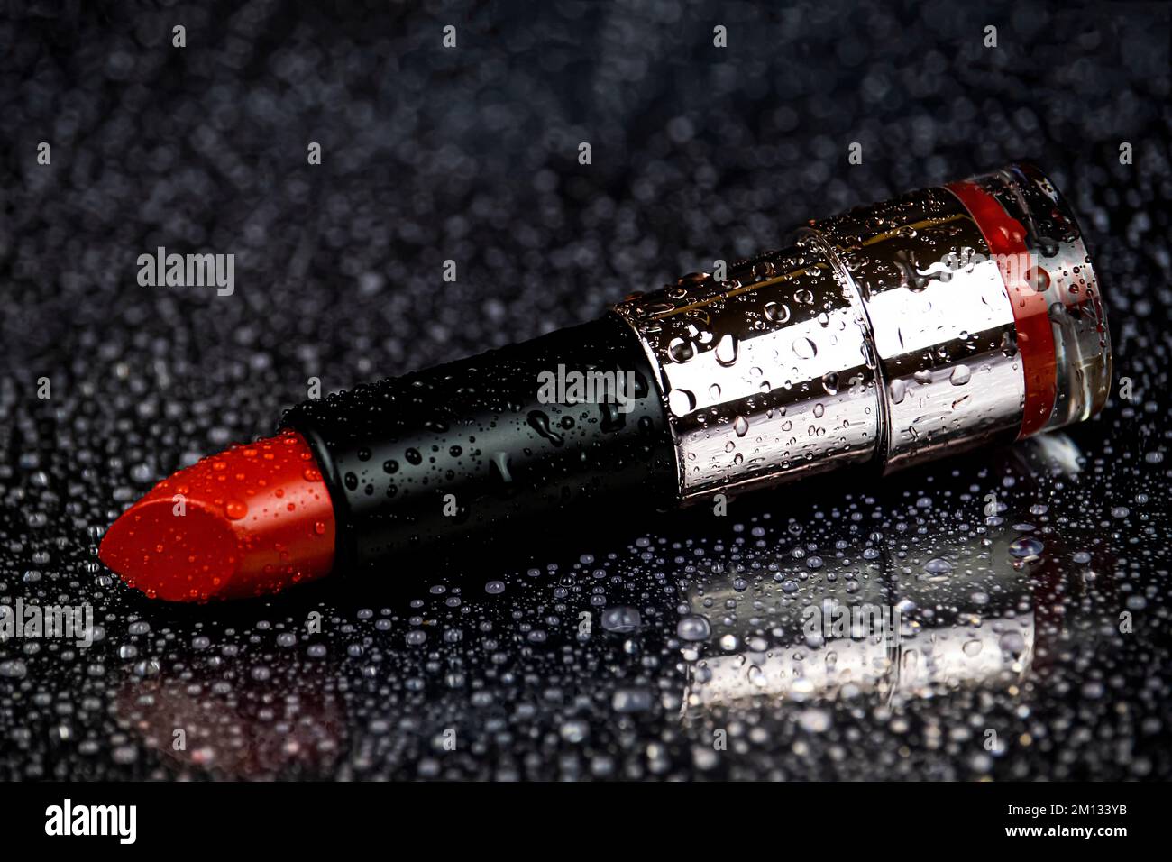 Red lipstick with water drops Stock Photo