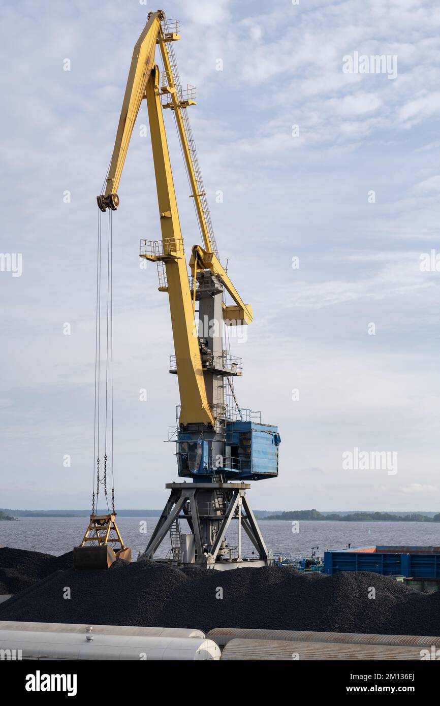 Rise tower crane over coastal terminal as charcoal is being loaded onto ...