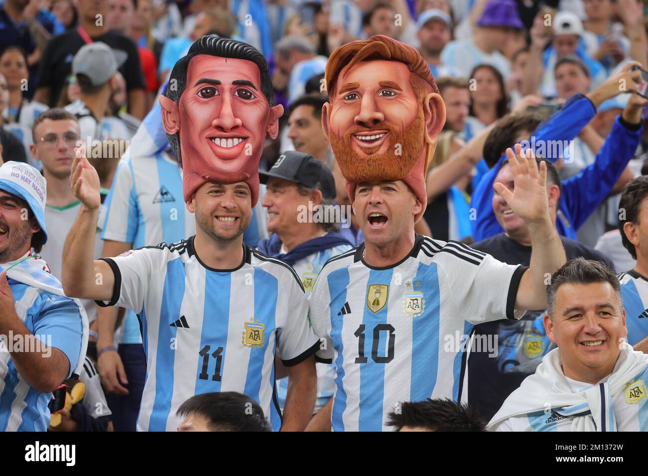 Lusail, Qatar. 09th Dec, 2022. Angel Di Maria of Argentina and Lionel Messi of Argentina fans with masks on during the FIFA World Cup Qatar 2022 Quarter Final match between Netherlands and Argentina at Lusail Stadium, Lusail, Qatar on 9 December 2022. Photo by Peter Dovgan. Editorial use only, license required for commercial use. No use in betting, games or a single club/league/player publications. Credit: UK Sports Pics Ltd/Alamy Live News Stock Photo