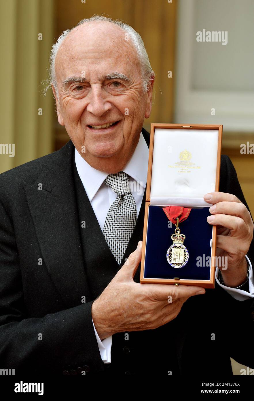 File photo dated 15/5/2015 of Lord Young of Graffham holds his insignia of member of the Order of the Companions of Honour after it was presented to him by the Prince of Wales, at the Investiture ceremony in Buckingham Palace in central London. Lord Young of Graffham, a Cabinet minister under Margaret Thatcher and a successful businessman, has died aged 90. A Conservative peer, he became secretary of state for employment in 1985, before being appointed secretary of state for trade and industry after the 1987 election. Issue date: Friday December 9, 2022. Stock Photo