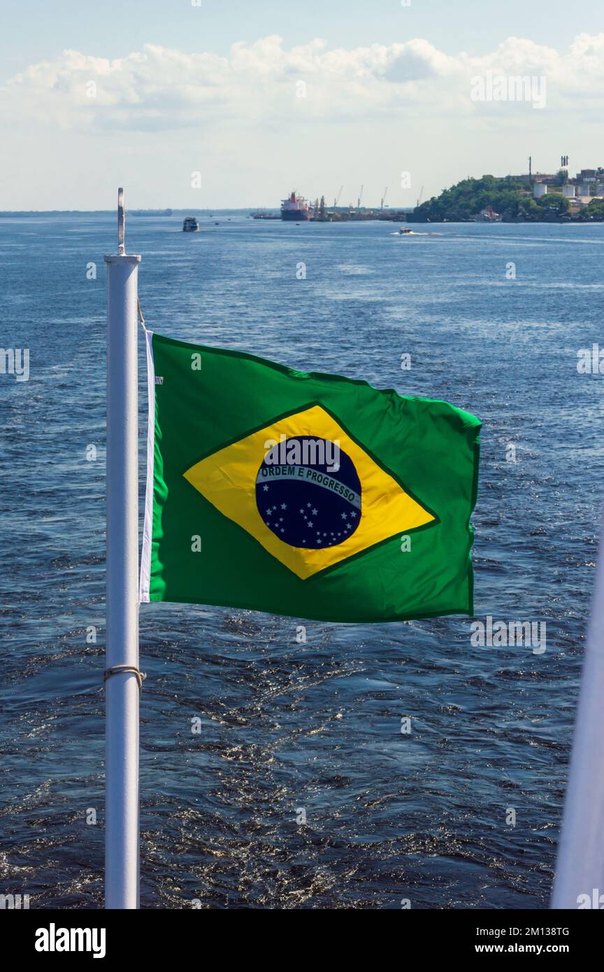 Brazil flag on the cruise along the Rio Amazonas between Manaus and Belem Stock Photo