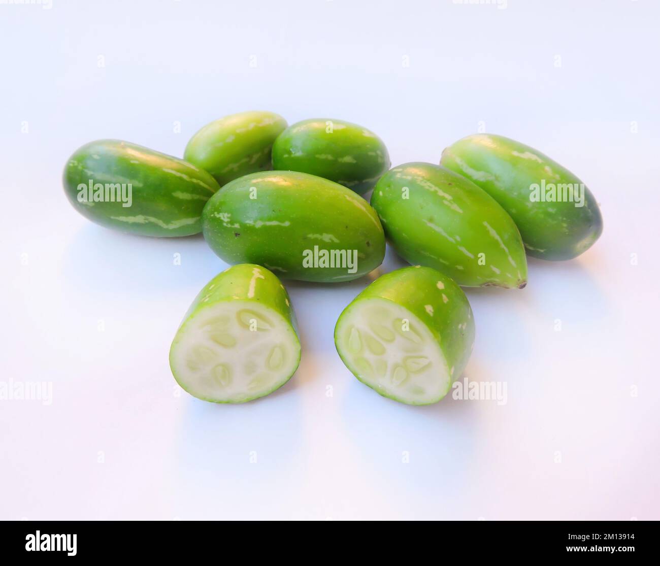 Ivy gourd (Coccinia grandis) also known as scarlet gourd, tindora, and kowai fruit, is a tropical vine of family Cucurbitaceae. Mainly found in India. Stock Photo