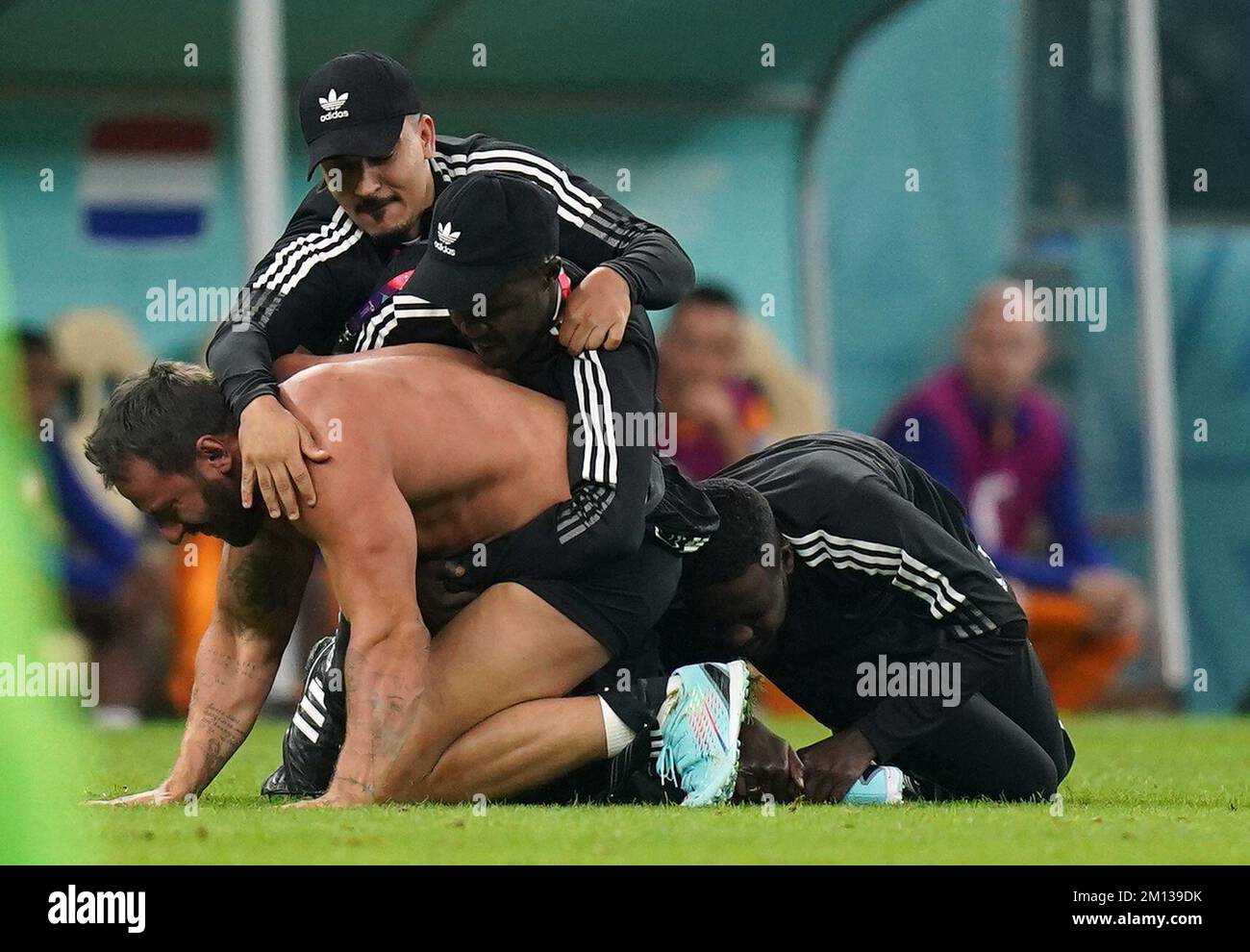 A Pitch Invader Is Wrestled To The Ground During The Fifa World Cup A Pitch Invader Is Wrestled To The Ground During The Fifa World Cup