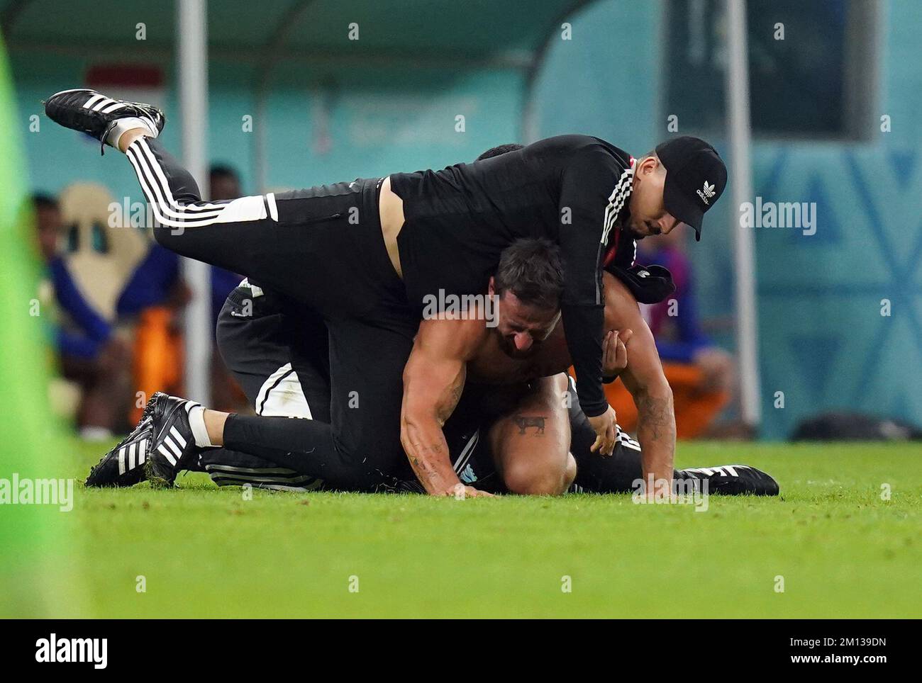 A Pitch Invader Is Wrestled To The Ground During The Fifa World Cup A Pitch Invader Is Wrestled To The Ground During The Fifa World Cup
