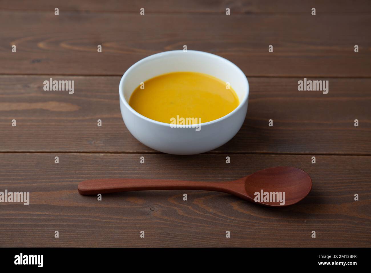 pumpkin potage soup isolated on table Stock Photo