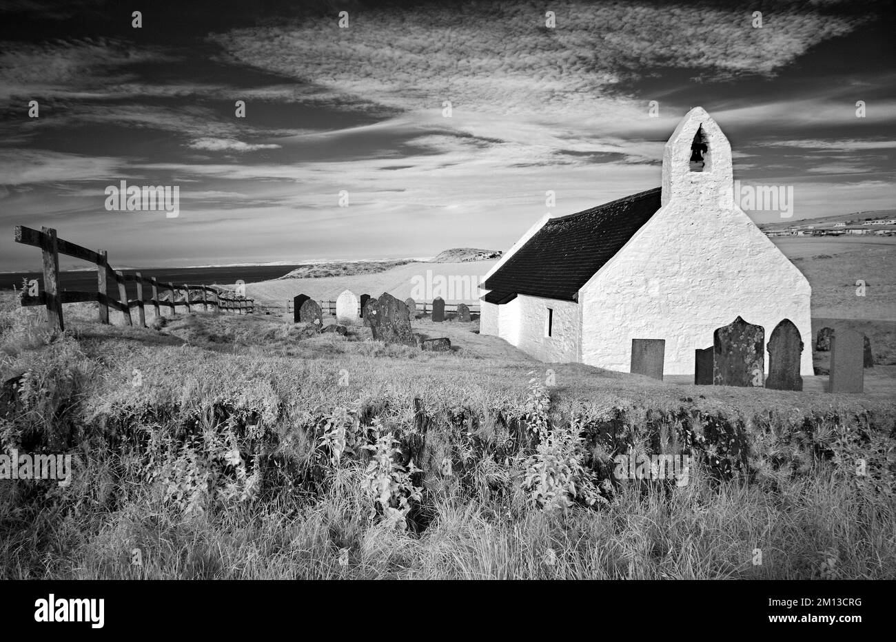 infrared landscape photograph of 6th century holycross church at Mwnt by the cardigan (ceredigion) coastal path  north ceredigion wales uk Stock Photo