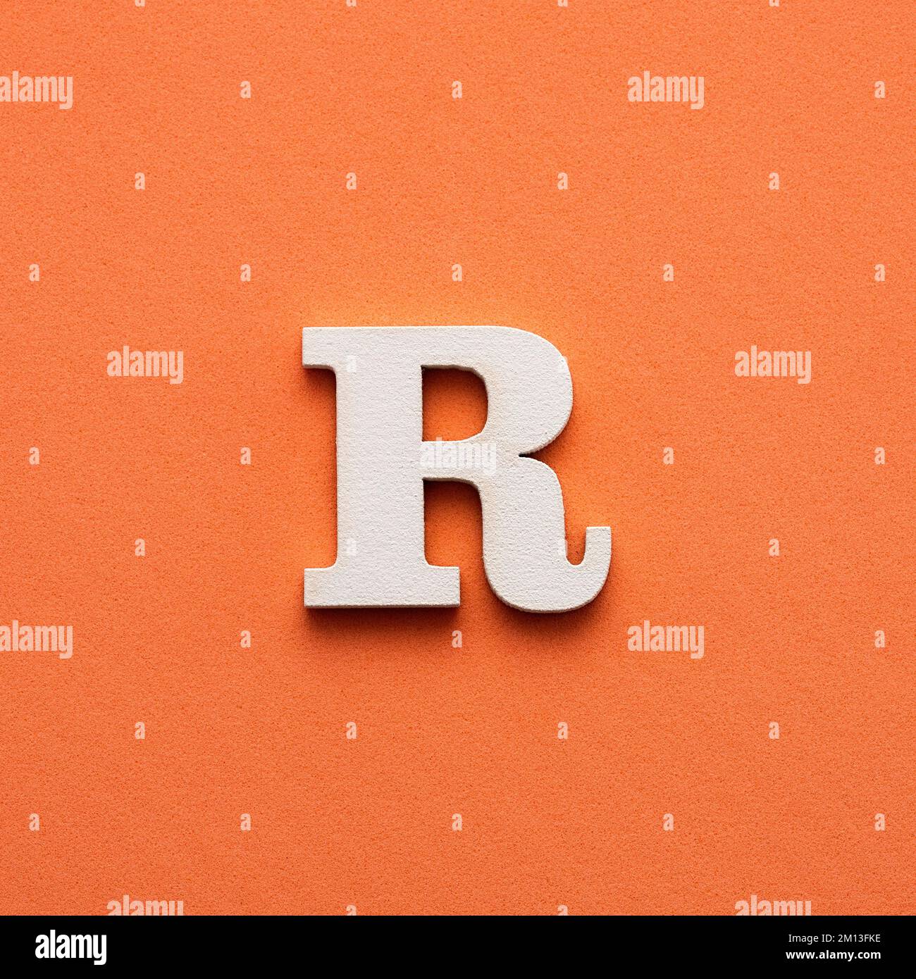 Alphabet letter R - White wooden letter on pink background Stock Photo ...