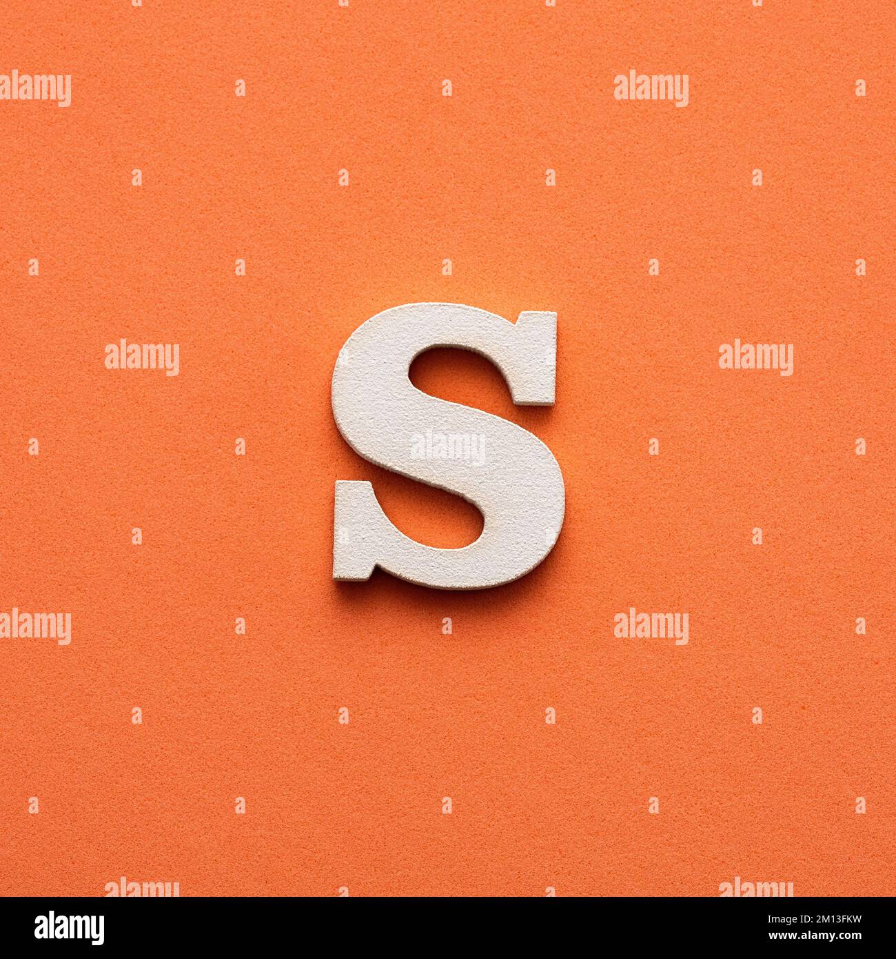 Letter S uppercase - white wooden font on pink background Stock Photo