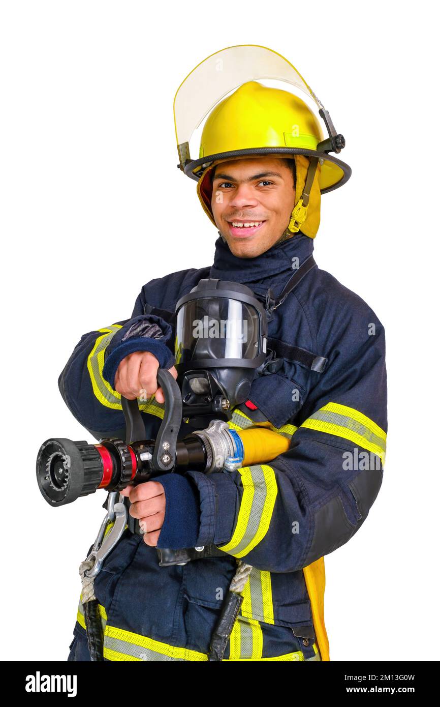 Fireman in uniform and hardhat holds firehose in hands Stock Photo