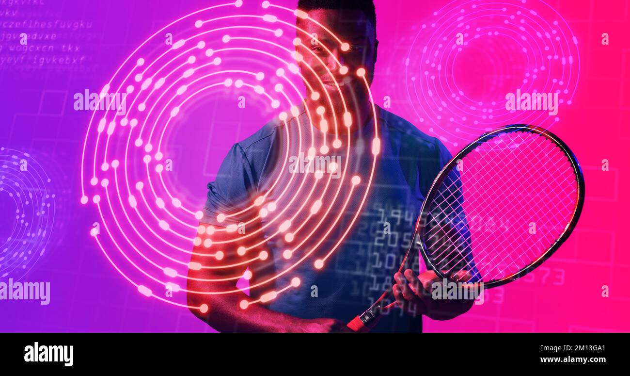 African american male tennis player with racket standing over