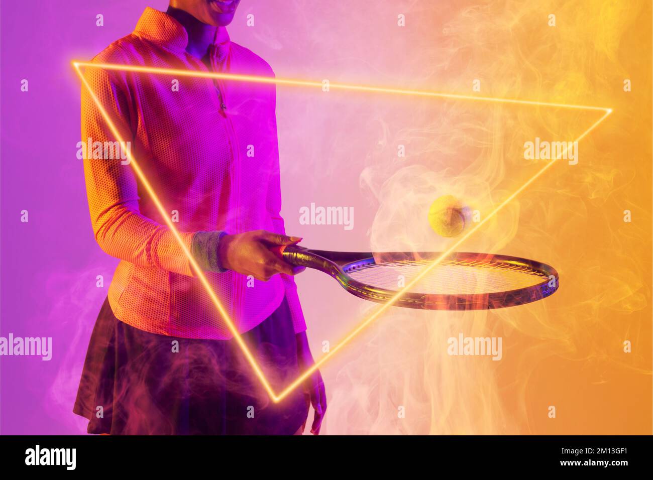 Midsection Of African American Female Player Playing With Racket And midsection-of-african-american-female-player-playing-with-racket-and