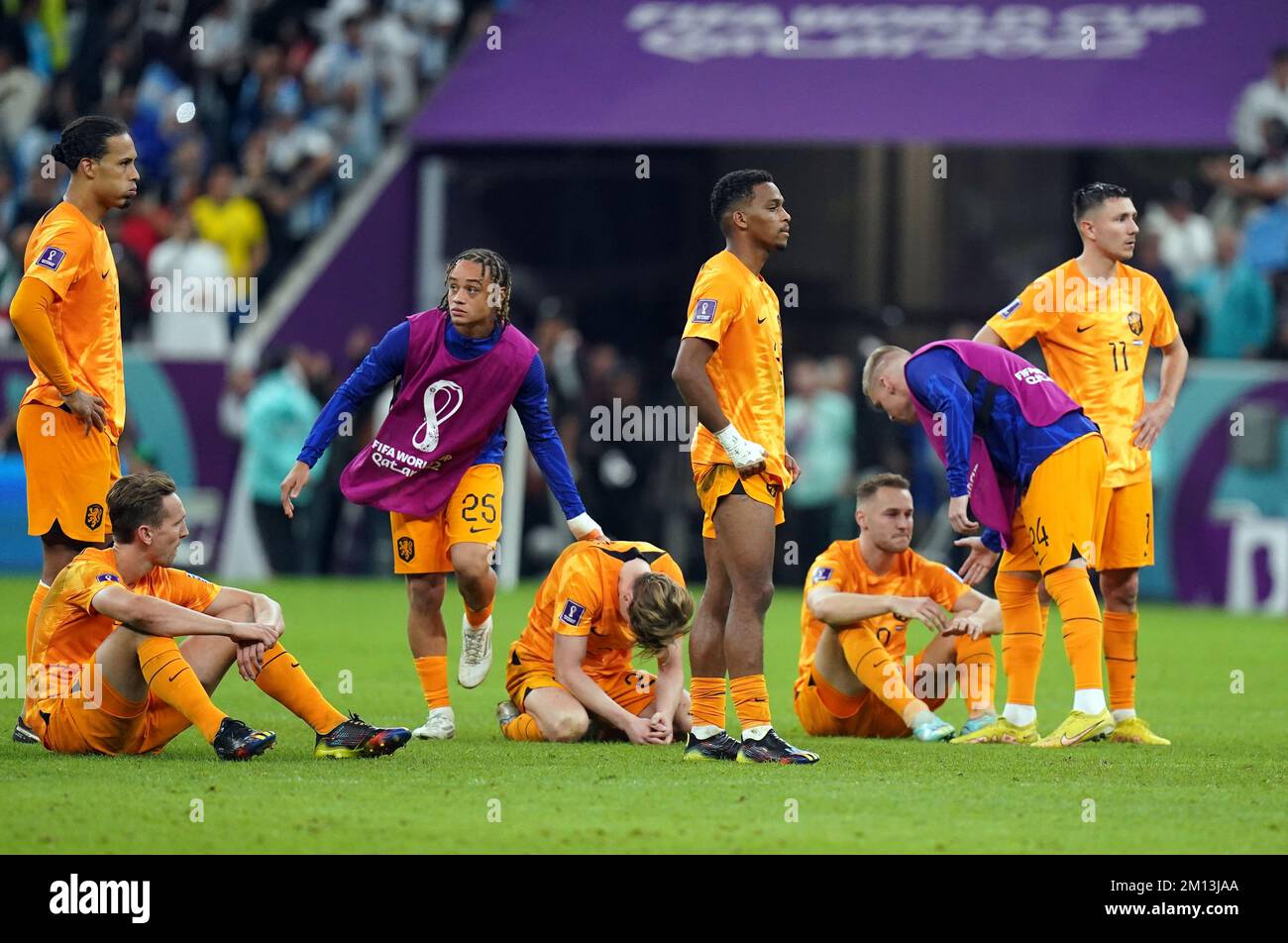 Netherlands Players Stand Dejected After Their Sides Defeat In The