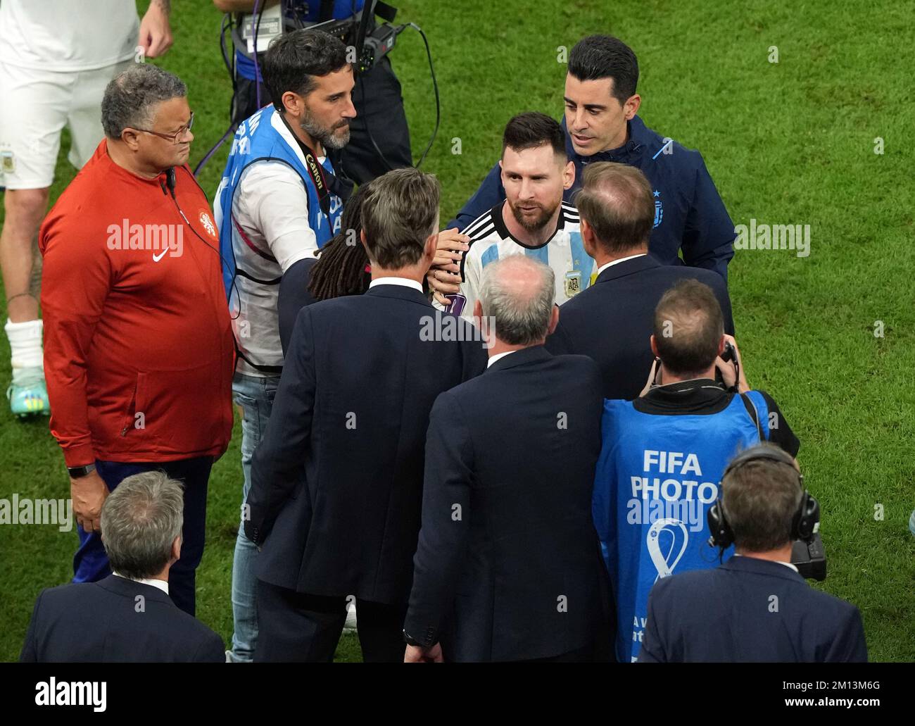 Argentina's Lionel Messi with Netherlands manager Louis van Gaal ...
