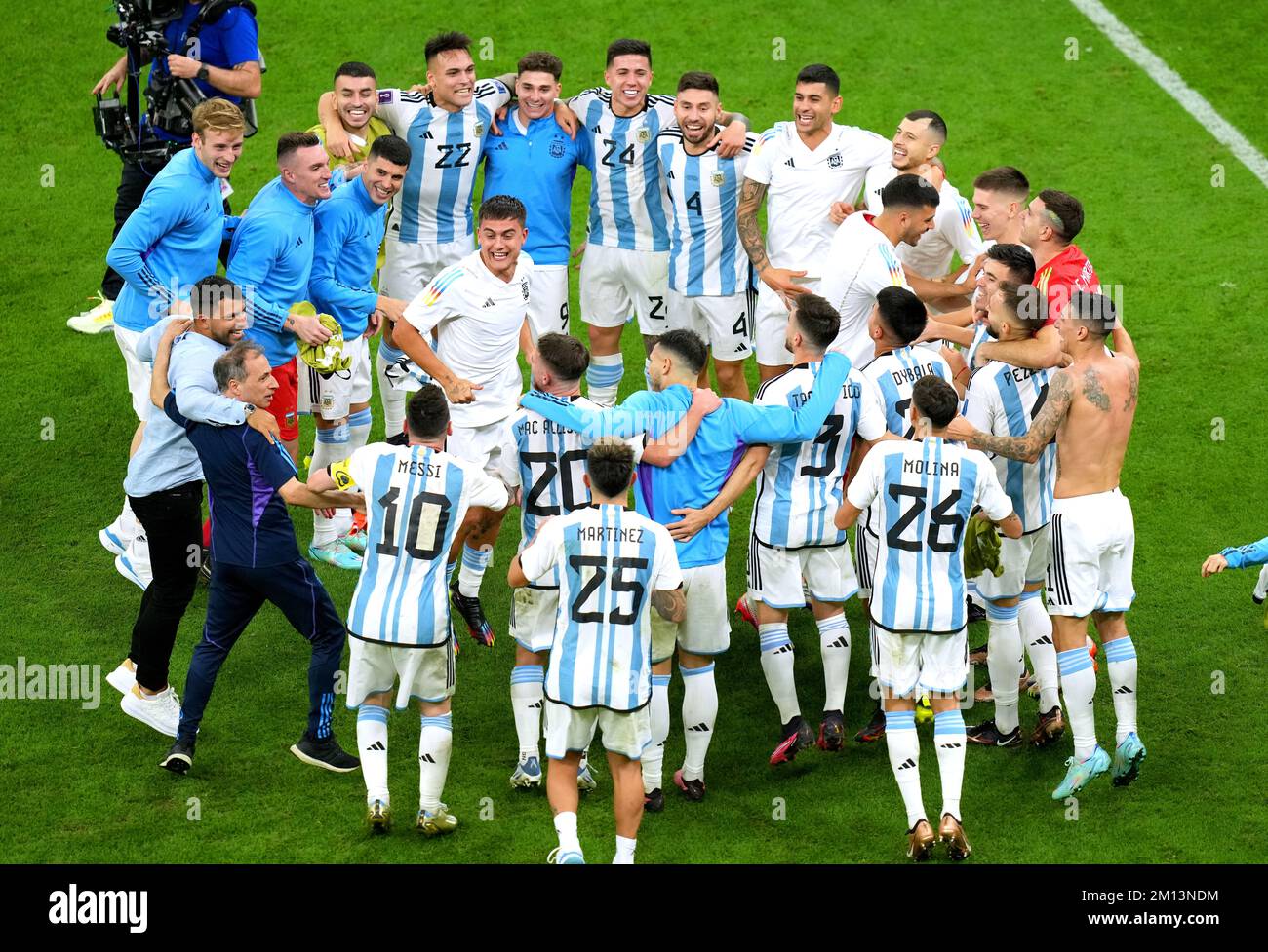 Former Argentina player Sergio Aguero (left, black jeans) celebrates with the players on the pitch following Argentina's victory in the penalty shoot-out of the FIFA World Cup Quarter-Final match at the Lusail Stadium in Lusail, Qatar. Picture date: Friday December 9, 2022. Stock Photo