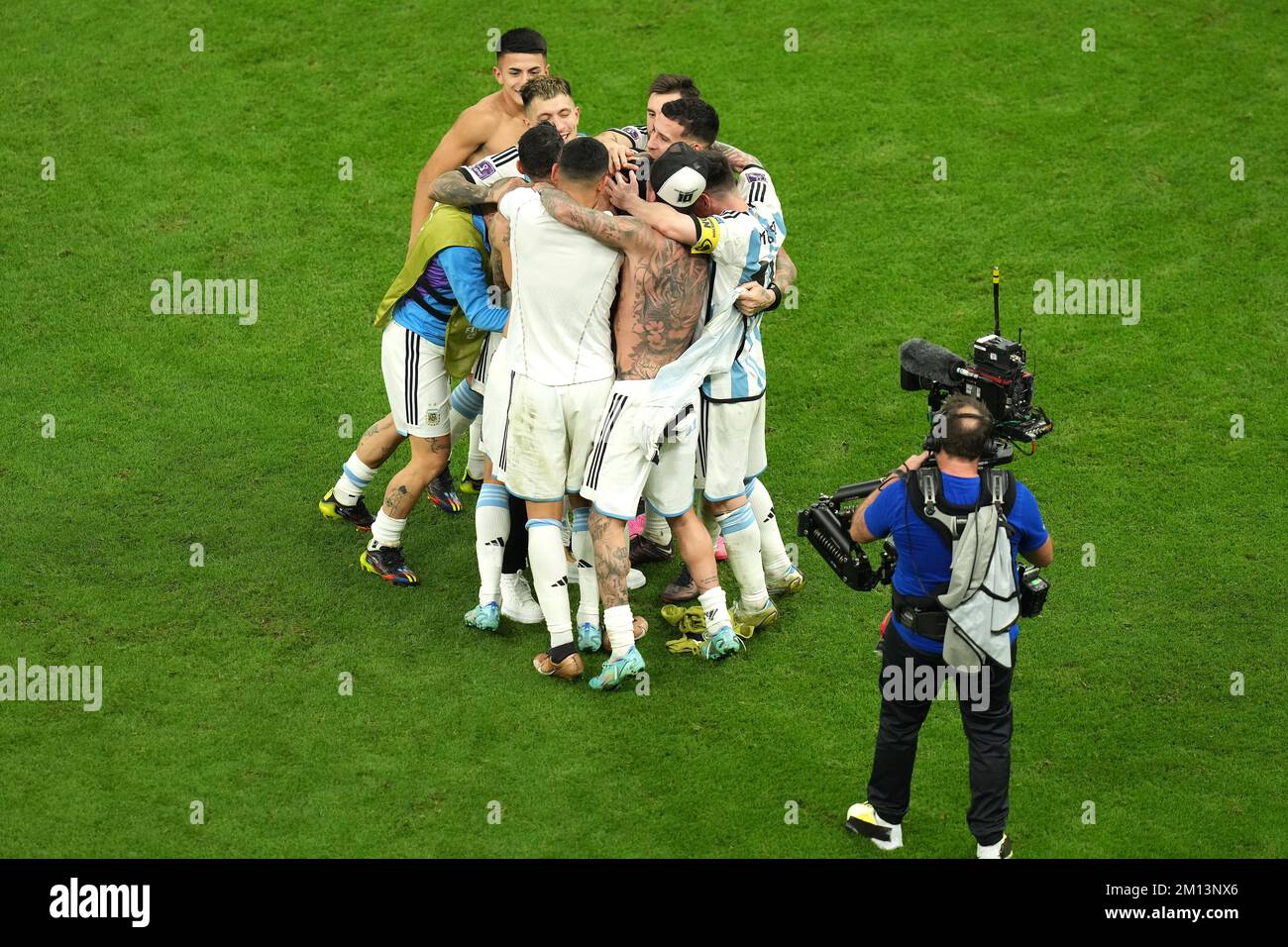 Former Argentina player Sergio Aguero (centre) is surrounded by current players after Argentina win the penalty shootout following extra time in the FIFA World Cup Quarter-Final match at the Lusail Stadium in Lusail, Qatar. Picture date: Friday December 9, 2022. Stock Photo