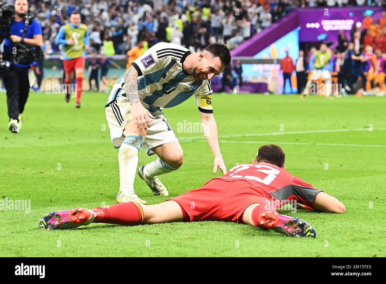 9th December 2022: Lusail Stadium, Lusail, Qatar: FIFA World Cup football, quarter finals, Netherlands versus Argentina: Lionel Messi Argentina, 10 and Emiliano Martinez Argentina, celebrate after 5-6 penalty kick win Stock Photo