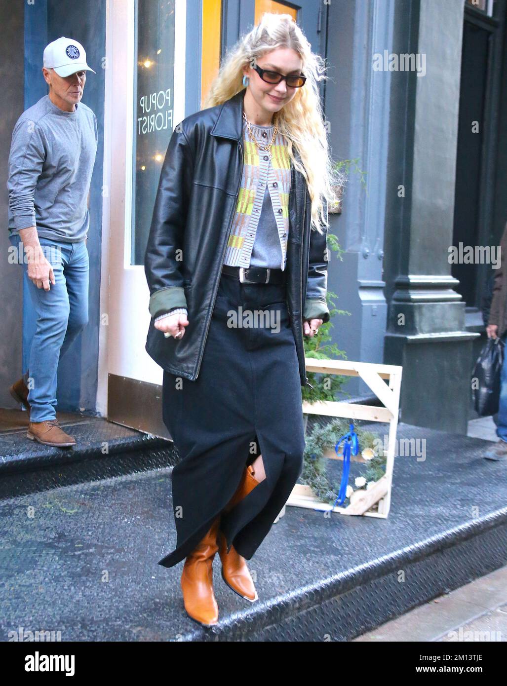 New York, USA. 09th Dec, 2022. Top model Gigi Hadid leaves her pop-up store  Guest in Residence a cashmere knitwear brand in Soho, New York, NY on  December 9, 2022. Photo by