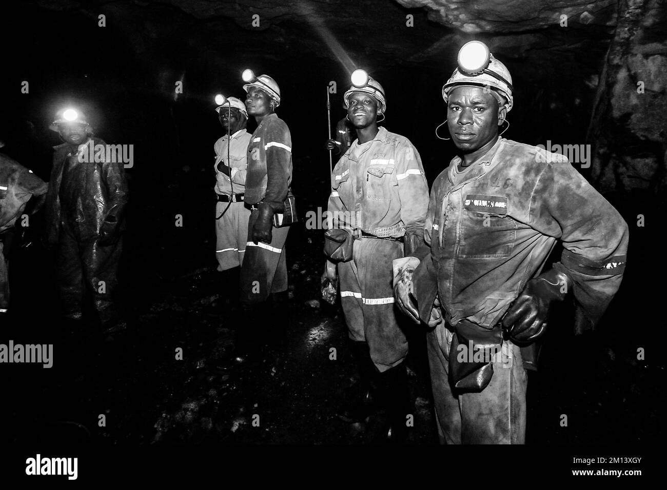 A group of people with mining equipment at the underground platinum
