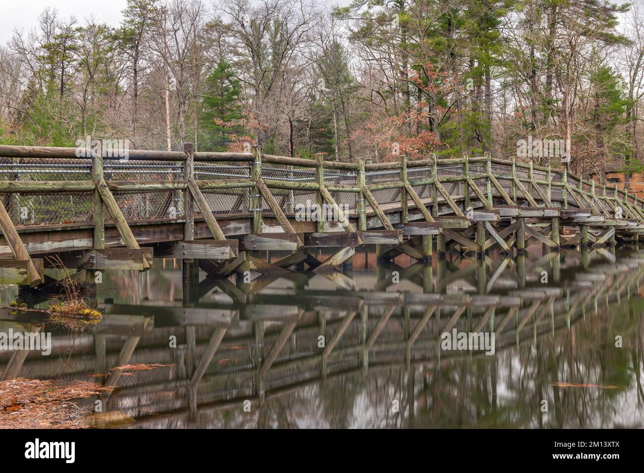 A bridge in Cumberland Mountain State Park crosses Center Hill Lake to move between a campsite and hiking trails win the wilderness. Stock Photo