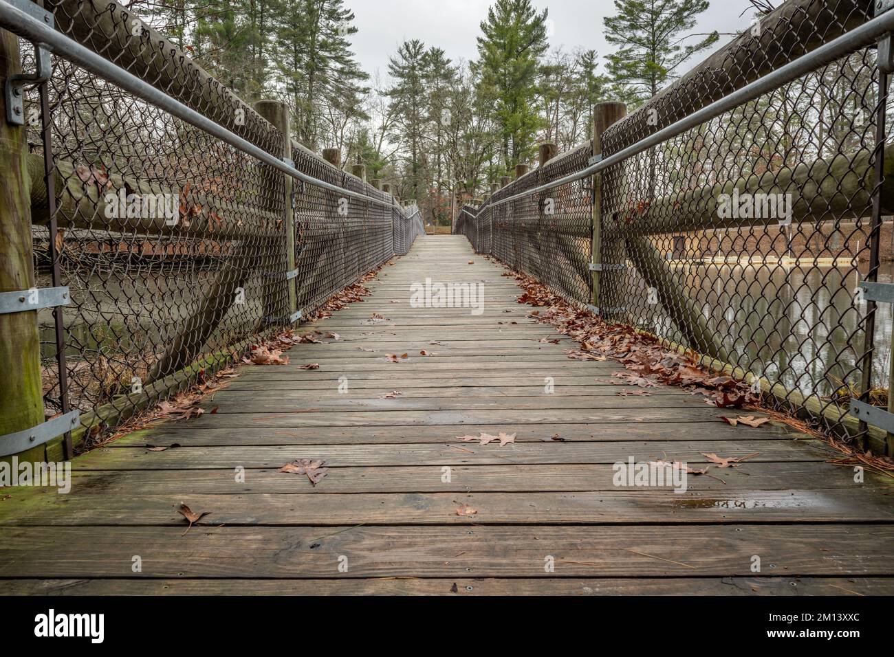 A bridge in Cumberland Mountain State Park crosses Center Hill Lake to move between a campsite and hiking trails win the wilderness. Stock Photo