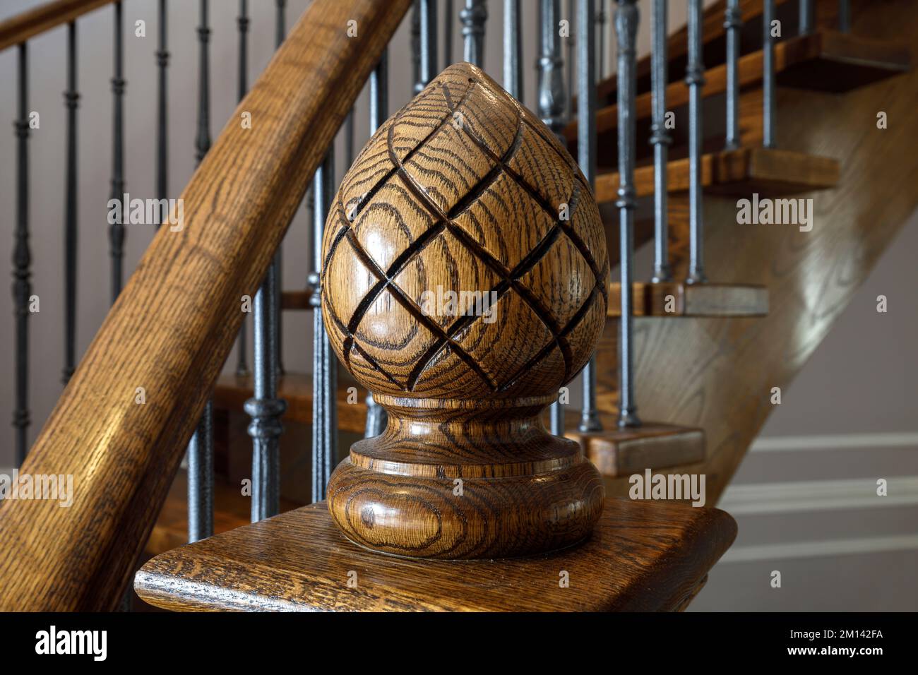 A decorative newel cap made out of wood and stained.  This house has since been demolished. Stock Photo