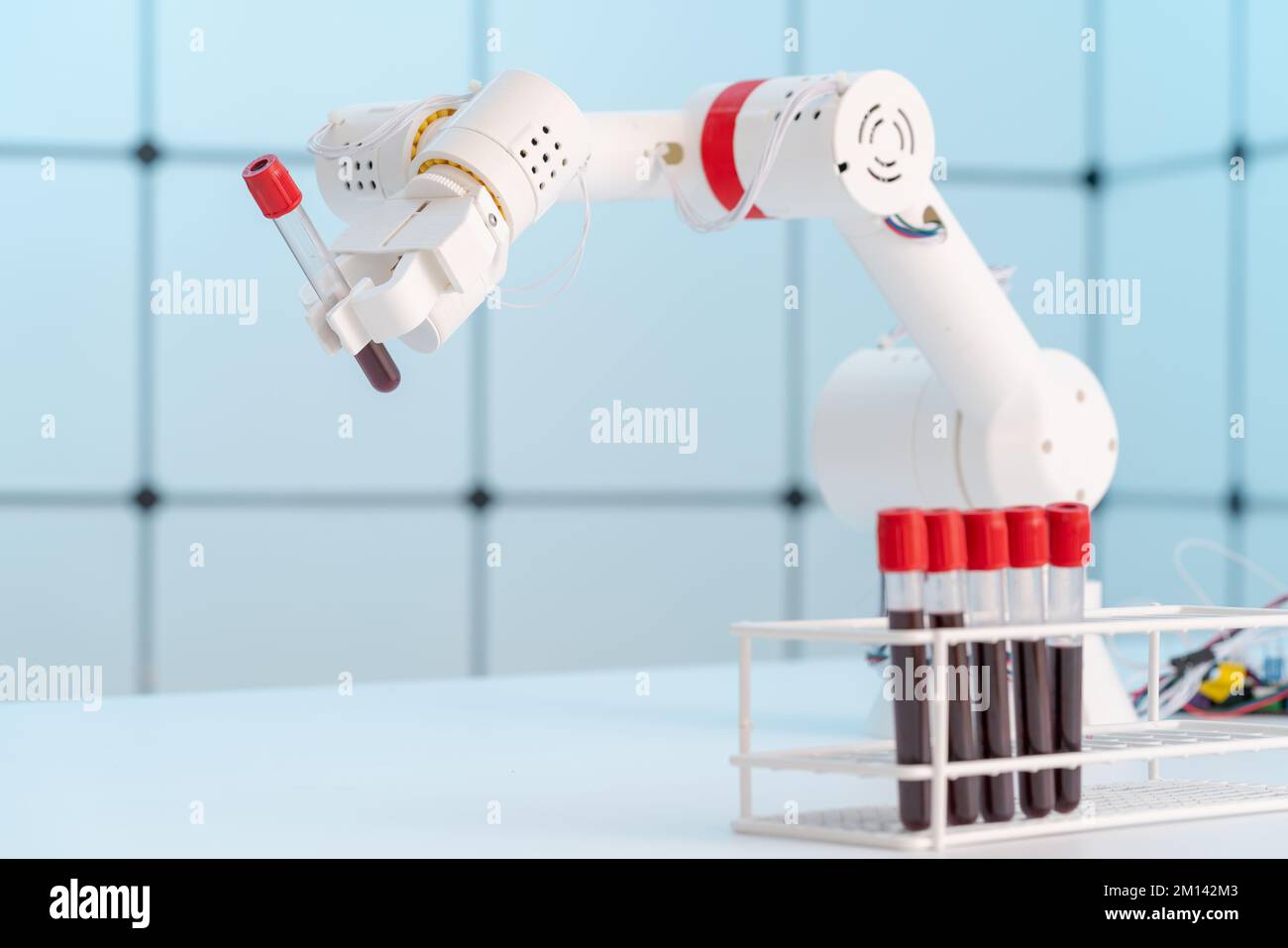 Robotic arm holding blood sample Stock Photo Alamy