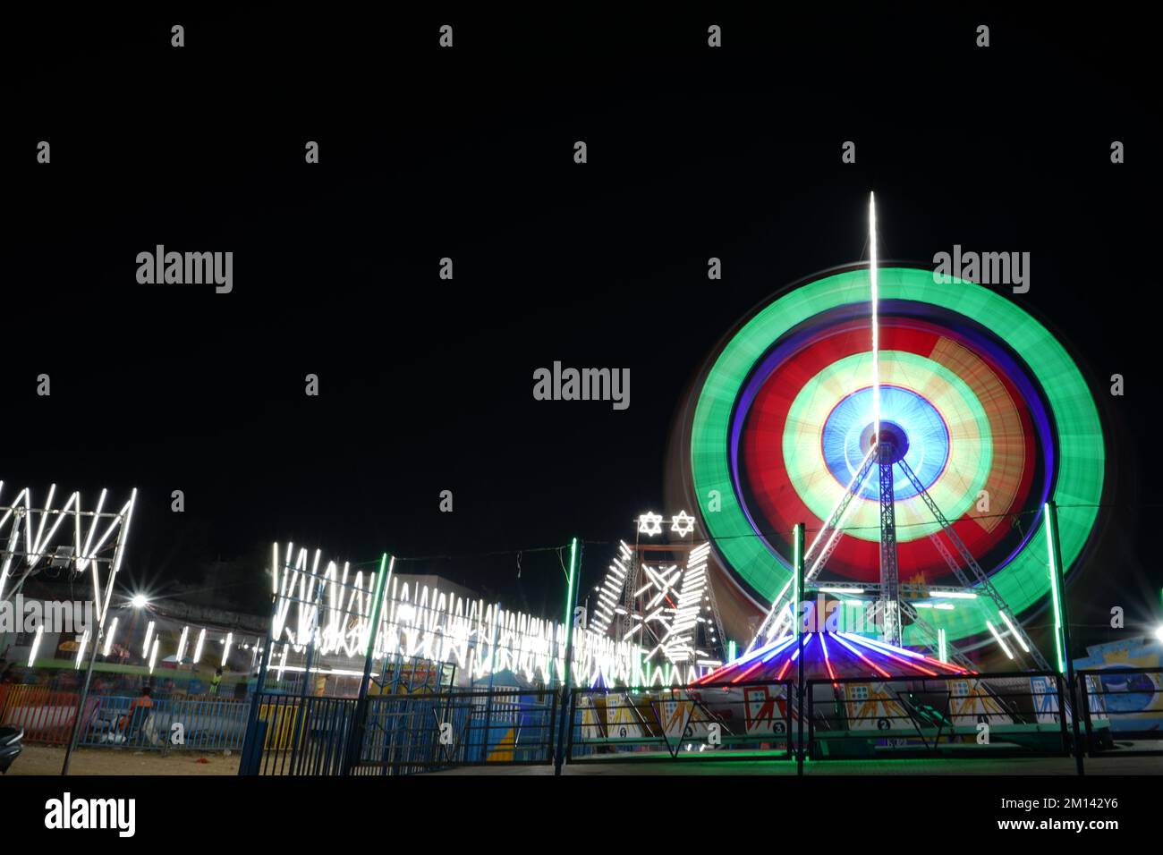Long Exposure slow shutter speed Shot of a Spinning Ferris Wheel with ...