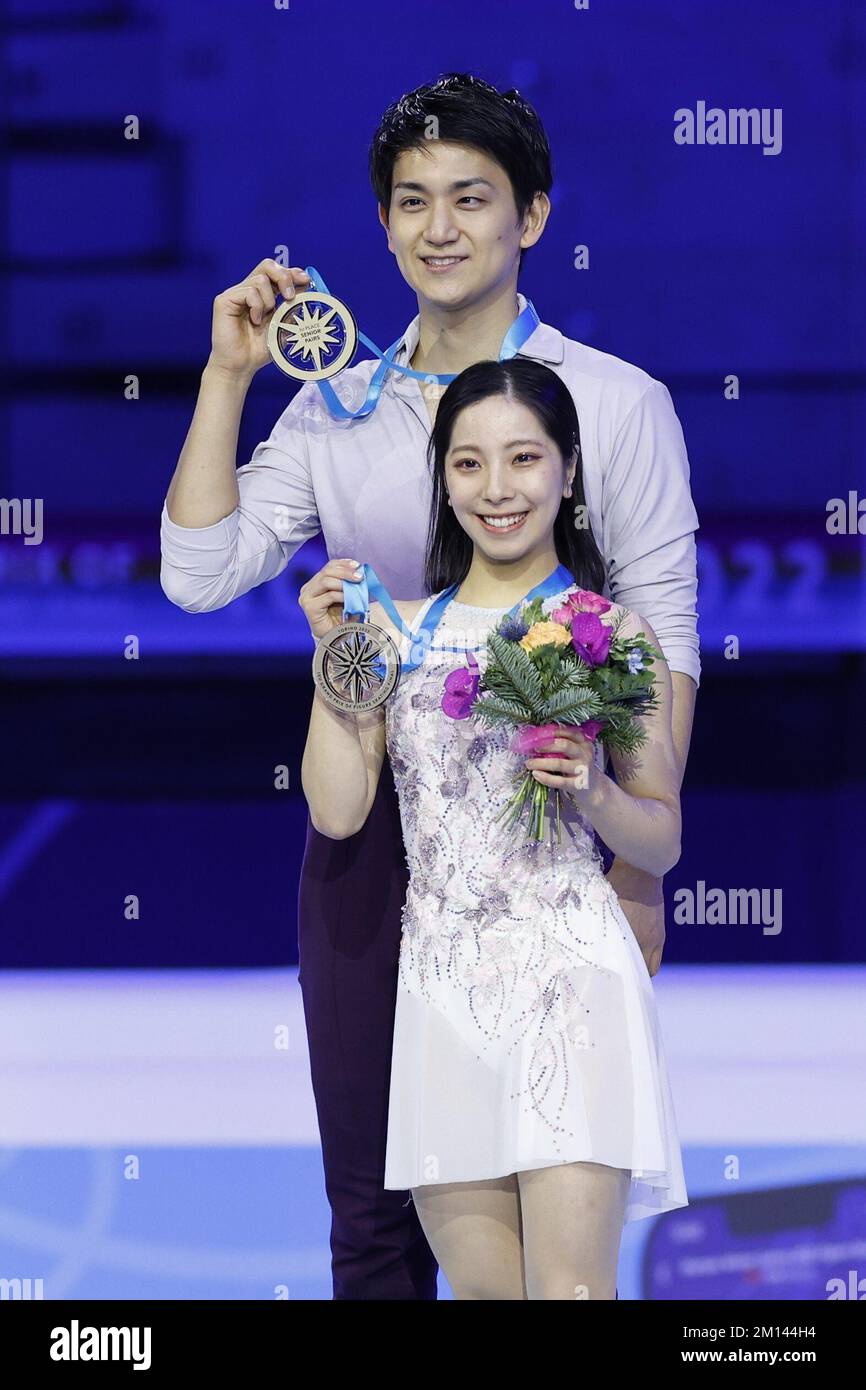 Pairs skaters Riku Miura (front) and Ryuichi Kihara of Japan pose after
