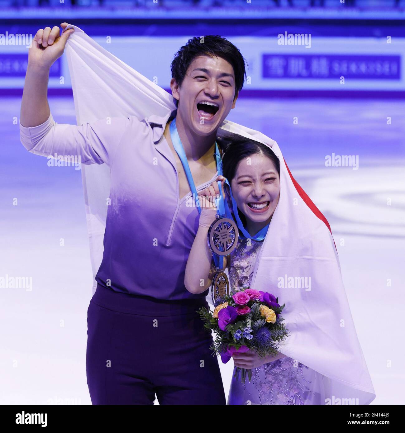 Pairs skaters Riku Miura (R) and Ryuichi Kihara of Japan celebrate