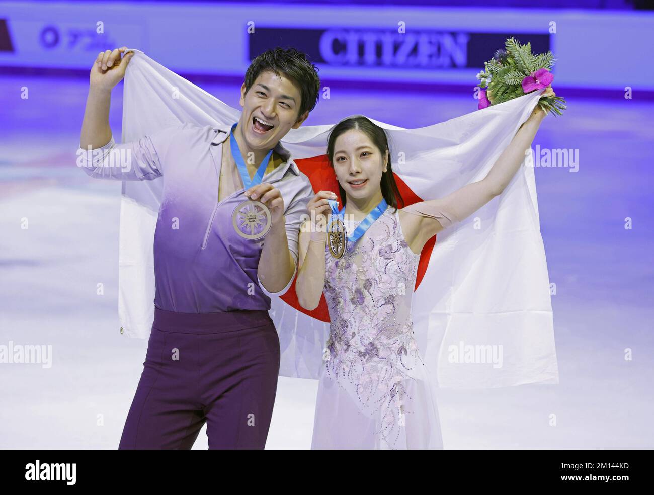 Pairs skaters Riku Miura (R) and Ryuichi Kihara of Japan celebrate