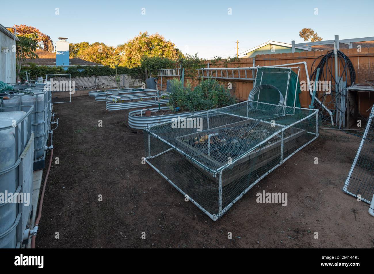 Enclosed raised beds and compost in a backyard  Stock Photo