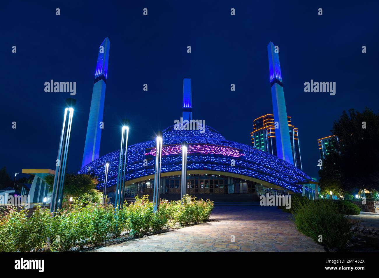 ARGUN, RUSSIA - SEPTEMBER 28, 2021: Mosque 'Mother's Heart' in night blue illumination on September night Stock Photo