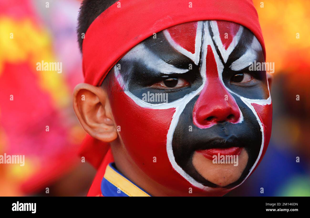 A performance in a costume and painted face performs in 108 the great ...